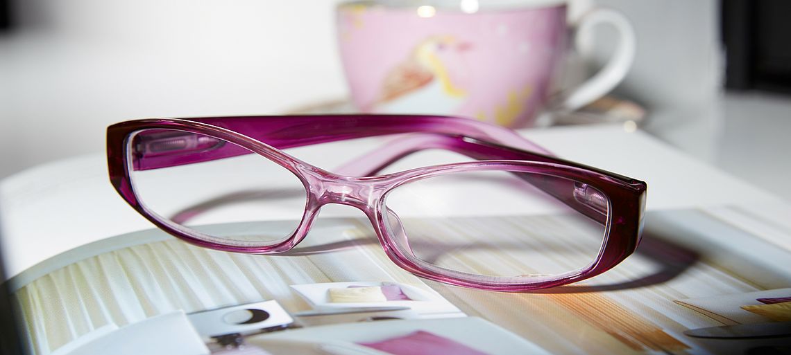 Reading glasses Verona lying on a book