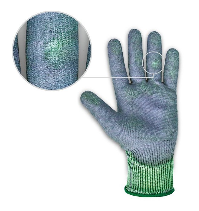 [Translate to French:] Market standard safety glove with visible abrasion after sandpaper test