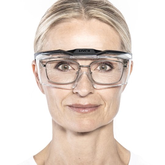 Woman with angular prescription spectacles and uvex OTG plus overspecs