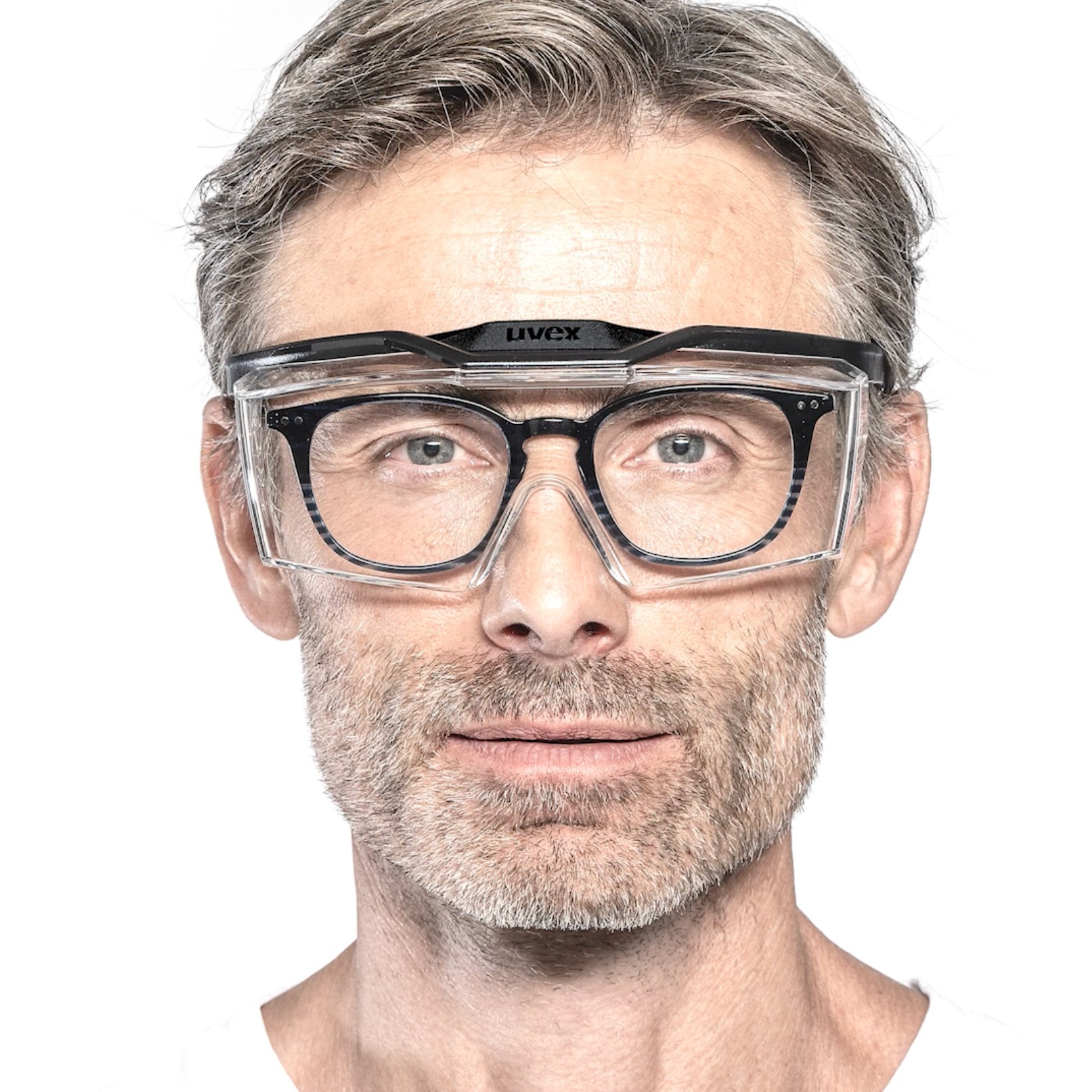 Man with oval prescription spectacles and uvex OTG plus overspecs