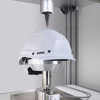White uvex safety helmet being tested